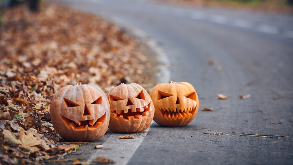 Jack-o-lanterns on a road.