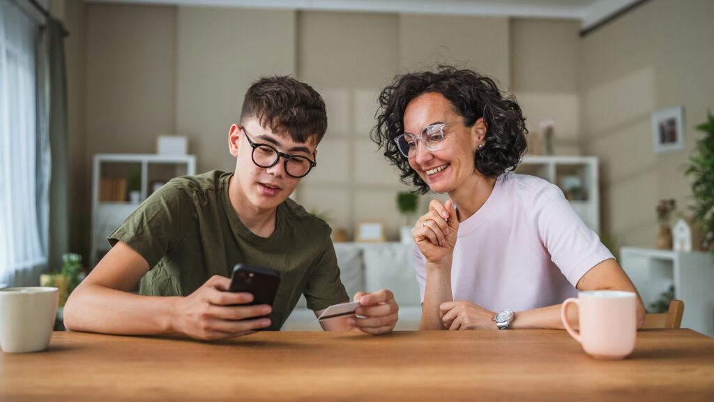 Woman and boy activating credit card.