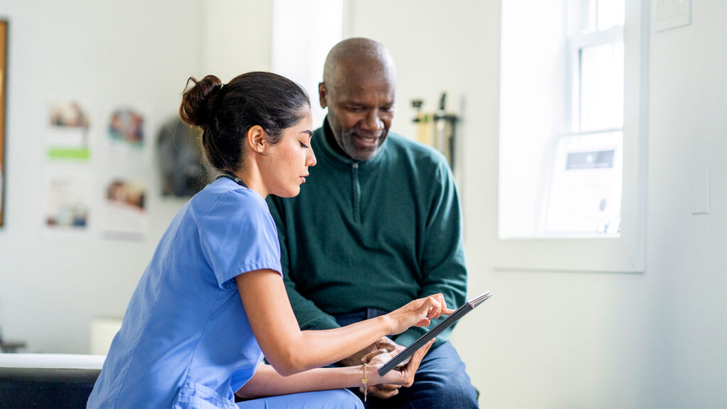 Nurse talking to a patient.