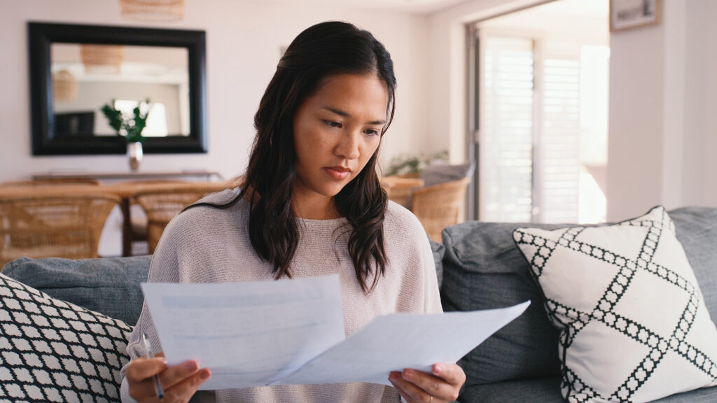 Woman reviewing paperwork.