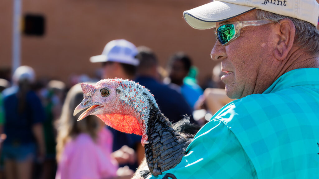 Person holding a turkey.