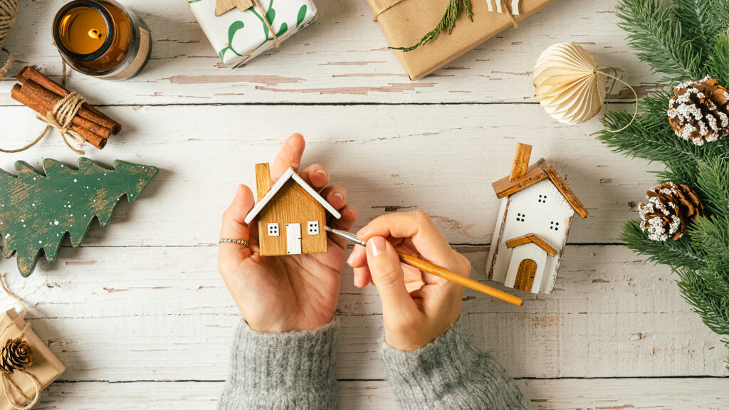 Person painting an ornament.
