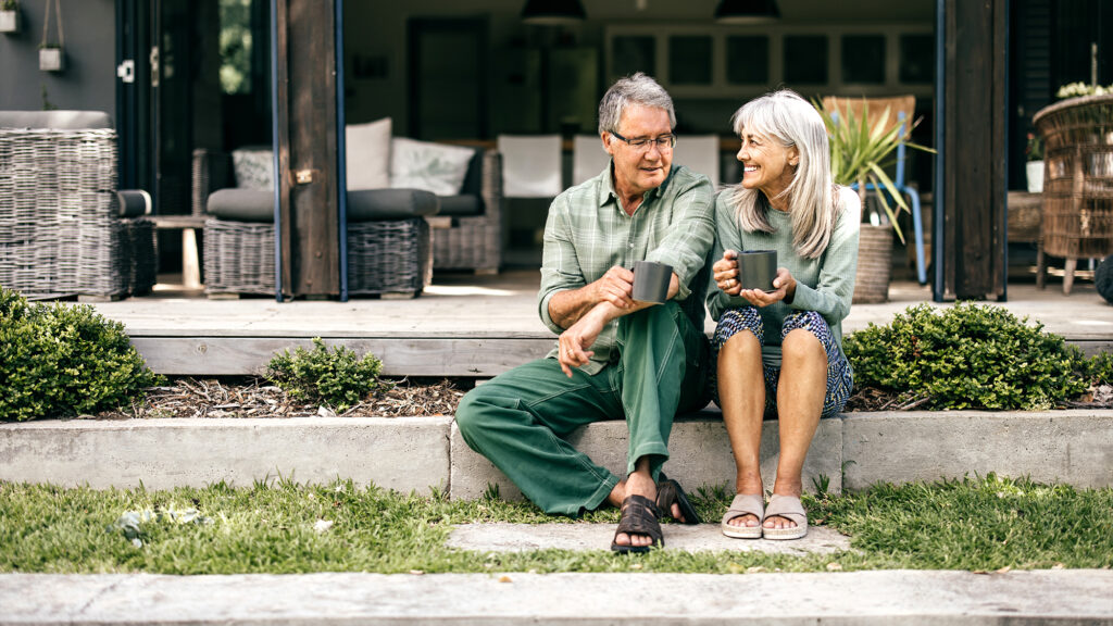 Older couple sitting on a porch.
